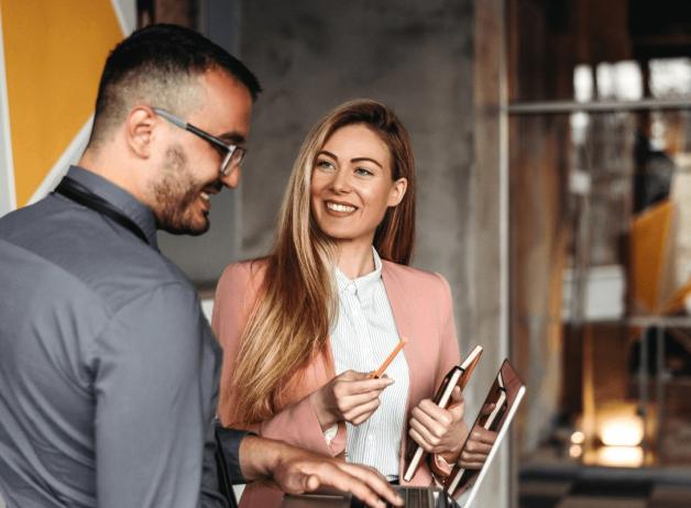 Man and lady talking at work